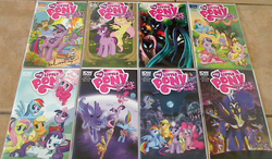 Size: 616x359 | Tagged: safe, idw, applejack, fluttershy, pinkie pie, princess luna, queen chrysalis, rainbow dash, rarity, spike, twilight sparkle, g4, collection, comics, photo