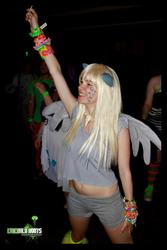 Size: 640x960 | Tagged: safe, derpy hooves, human, g4, cosplay, dancing, ears, irl, irl human, photo, rave, wings, wristband