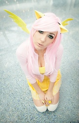 Size: 582x900 | Tagged: safe, artist:jessica nigri, fluttershy, human, g4, cleavage, clothes, cosplay, cute, female, irl, irl human, looking at you, photo, solo, sweater, sweatershy