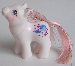 Size: 656x579 | Tagged: safe, baby stella, earth pony, pony, g1, blushing, female, filly, foal, irl, photo, solo, tail, toy