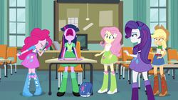 Size: 1128x630 | Tagged: safe, screencap, applejack, fluttershy, pinkie pie, rarity, twilight sparkle, equestria girls, g4, my little pony equestria girls, charlie brown, classroom, disguise, female, incomplete twilight strong, peanuts, table, tara strong, voice actor joke