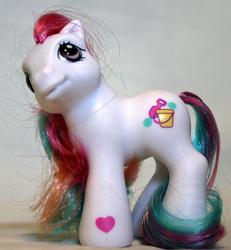 Size: 677x734 | Tagged: safe, photographer:lilcricketnoise, earth pony, pony, g3, baby sandy island, female, filly, foal, hoof heart, irl, photo, toy, underhoof