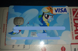 Size: 960x624 | Tagged: safe, rainbow dash, g4, clothes, credit card, goggles, uniform, wonderbolts