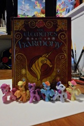 Size: 3072x4608 | Tagged: safe, applejack, fluttershy, pinkie pie, rainbow dash, rarity, twilight sparkle, g4, blind bag, book, elements of harmony, figure, irl, mane six, merchandise, photo, toy