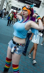 Size: 539x899 | Tagged: safe, artist:geekeryandsuch, rainbow dash, human, g4, belly button, big breasts, breasts, busty rainbow dash, cosplay, flexing, irl, irl human, midriff, photo, rainboob dashie ali