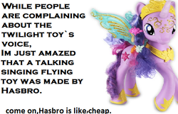 Size: 562x363 | Tagged: safe, artist:ponyprincessqueen, twilight sparkle, alicorn, pony, g4, cheap, crystal princess celebration, electronic toy, female, hasbro, irl, photo, reaction, toy, twilight sparkle (alicorn)