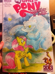 Size: 538x720 | Tagged: safe, artist:katie cook, applejack, fluttershy, bear, earth pony, pegasus, pony, ursa, ursa minor, g4, cover, female, irl, mare, photo, traditional art, watercolor painting