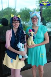 Size: 1365x2048 | Tagged: safe, artist:cupcakenote, artist:sweetkey, bon bon, lyra heartstrings, sweetie drops, human, g4, clothes, cosplay, cutie mark on clothes, duo, glasses, irl, irl human, outdoors, photo, plushie