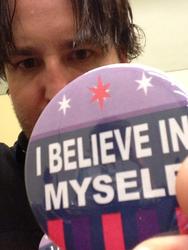Size: 692x922 | Tagged: safe, human, button, i believe in m.a. larson, i believe in x, irl, irl human, larson you magnificent bastard, m.a. larson, photo, solo, twitter