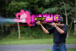 Size: 1019x683 | Tagged: safe, edit, pinkie pie, earth pony, human, pony, g4, american presidents, barack obama, female, frown, glare, gritted teeth, gun, irl, irl human, laser, mare, photo, pointing, pony cannonball, president, rifle, rocket launcher, shooting, wat, weapon
