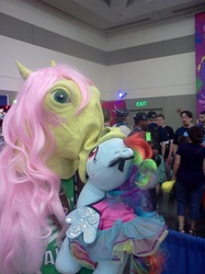 Size: 1280x1707 | Tagged: safe, fluttershy, rainbow dash, human, bronycon, g4, build-a-bear, cosplay, female, hoers mask, irl, irl human, kissing, lesbian, merch kissing, photo, plushie, rainbow dash always dresses in style, ship:flutterdash, shipping, waifuwaifuflutterass