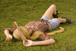 Size: 852x568 | Tagged: safe, artist:deniisseh, applejack, human, g4, cosplay, grass, irl, irl human, on back, photo, solo