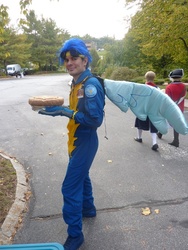 Size: 480x640 | Tagged: safe, soarin', human, g4, clothes, cosplay, food, irl, irl human, photo, pie, spread wings, uniform, wings, wonderbolts uniform