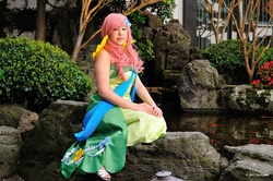 Size: 1280x852 | Tagged: safe, artist:areihanai, fluttershy, human, g4, animation on display, clothes, cosplay, dress, gala dress, irl, irl human, photo, solo