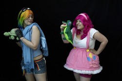 Size: 1620x1080 | Tagged: safe, artist:avalon cosplay, artist:avalon-cosplay, artist:blossoming cosplay, gummy, pinkie pie, rainbow dash, tank, human, g4, clothes, comic con, cosplay, face paint, fingerless gloves, gloves, goggles, irl, irl human, new york comic con, pet, photo, plushie, scarf, suspenders