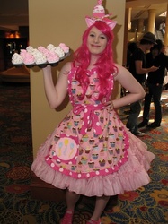 Size: 487x650 | Tagged: safe, artist:unkcos2, pinkie pie, human, g4, anime usa, apron, clothes, convention, cosplay, cupcake, dress, food, irl, irl human, photo, platter, solo