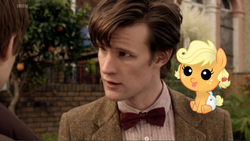 Size: 832x469 | Tagged: safe, artist:missbeigepony, applejack, earth pony, pony, g4, applebetes, baby, baby pony, babyjack, blazer, bowtie, clothes, crossover, cute, diaper, doctor who, eleventh doctor, foal, irl, matt smith, photo, pinstripe, ponies in real life, shirt, tweed