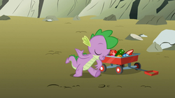 Size: 1054x592 | Tagged: safe, screencap, spike, dragon, a dog and pony show, g4, bowing, eyes closed, gem, male, smiling, solo, wagon