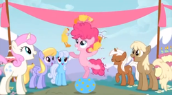 Size: 849x470 | Tagged: safe, screencap, cloud kicker, linky, mjölna, pinkie pie, shoeshine, silver spanner, twinkleshine, g4, pinkie pride, background pony, background pony audience, ball, female, filly, filly pinkie pie, frizzy hair, juggling, rubber chicken, younger