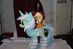 Size: 4272x2848 | Tagged: safe, artist:karasunezumi, applejack, lyra heartstrings, earth pony, human, pony, unicorn, g4, clothes, comparison, irl, irl human, life size, photo, plushie, saddle, socks, striped socks, tack, thigh highs, trio