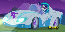 Size: 1205x597 | Tagged: safe, screencap, dj pon-3, vinyl scratch, equestria girls, g4, my little pony equestria girls: rainbow rocks, bassmobile, car, hood ornament