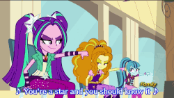 Size: 576x324 | Tagged: safe, screencap, adagio dazzle, aria blaze, sonata dusk, sweetie belle, trixie, equestria girls, g4, my little pony equestria girls: rainbow rocks, adagio dazzle gets around, animated, battle of the bands, discovery family, discovery family logo, female, subtitles, the dazzlings, thumbs down