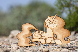 Size: 3198x2132 | Tagged: safe, artist:earth-pony, artist:nekocrispy, princess celestia, g4, craft, female, high res, prone, pyrography, smiling, solo, traditional art, woodwork