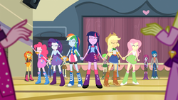 Size: 1366x768 | Tagged: safe, screencap, adagio dazzle, applejack, aria blaze, fluttershy, mystery mint, pinkie pie, rainbow dash, rarity, scribble dee, sunset shimmer, thunderbass, twilight sparkle, valhallen, wiz kid, equestria girls, g4, my little pony equestria girls: rainbow rocks, background human, balloon, blurry, boots, bracelet, cookie, eyes closed, gasp, high heel boots, holding hands, jewelry, mane six, raised arm, smiling, twilight sparkle (alicorn)