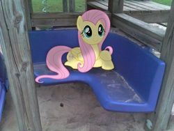 Size: 2048x1536 | Tagged: safe, artist:baumkuchenpony, artist:tokkazutara1164, fluttershy, g4, bench, cute, irl, photo, plastic, playset, ponies in real life, prone, sand, sitting, smiling, solo, vector