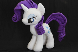 Size: 5184x3456 | Tagged: safe, artist:nekokevin, rarity, pony, unicorn, g4, black background, female, irl, mare, photo, plushie, simple background, smiling, solo