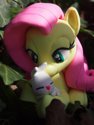 Size: 3024x4032 | Tagged: safe, artist:dustysculptures, angel bunny, fluttershy, g4, bedroom eyes, craft, cuddling, cute, hug, irl, photo, prone, sculpture, shyabetes, sleeping, smiling, snuggling, toy