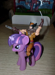 Size: 692x936 | Tagged: safe, twilight sparkle, g4, action figure, gift set, irl, photo, riding, toy, wolverine, wolverine riding twilight