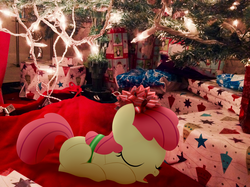 Size: 2592x1936 | Tagged: safe, artist:dtcx97, apple bloom, earth pony, pony, bow, christmas, christmas tree, female, filly, foal, holiday, irl, photo, ponies in real life, present, ribbon, sleeping, solo, tree