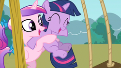 Size: 853x480 | Tagged: safe, screencap, princess cadance, twilight sparkle, pony, a canterlot wedding, g4, duo, eyes closed, female, filly, filly twilight sparkle, foalsitter, holding a pony, swing, swing set, teen princess cadance, younger