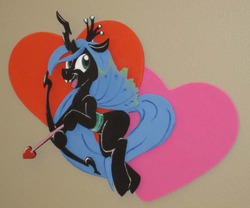 Size: 500x415 | Tagged: safe, artist:trollie trollenberg, queen chrysalis, changeling, changeling queen, g4, arrow, bow (weapon), bow and arrow, cupid, female, heart, heart arrow, photo, solo, traditional art