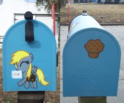 Size: 1280x1072 | Tagged: safe, artist:pezgirllovesrog, derpy hooves, pegasus, pony, g4, bag, customized toy, cute, female, irl, mail, mailbag, mailbox, mare, mouth hold, muffin, photo, smiling, wink