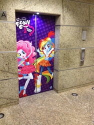 Size: 2448x3264 | Tagged: safe, pinkie pie, rainbow dash, equestria girls, g4, my little pony equestria girls: rainbow rocks, devil horn (gesture), elevator, hasbro mexico, irl, photo