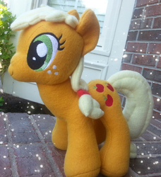 Size: 2184x2400 | Tagged: safe, artist:mintystitch, applejack, earth pony, pony, g4, floppy ears, irl, outdoors, photo, plushie, side view, solo