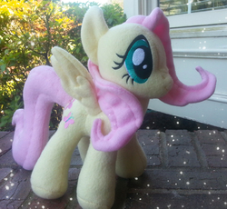 Size: 2448x2248 | Tagged: safe, artist:mintystitch, fluttershy, pegasus, pony, g4, irl, outdoors, photo, plushie, solo, spread wings, wings