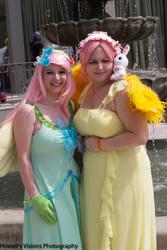Size: 1366x2048 | Tagged: artist needed, safe, fluttershy, human, g4, carolina anime day, clothes, cosplay, dress, duo, fountain, gala dress, irl, irl human, outdoors, photo, plushie
