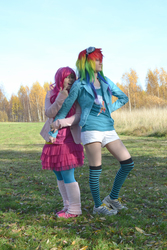 Size: 2475x3712 | Tagged: safe, artist:kiosa, artist:sardiini, pinkie pie, rainbow dash, human, g4, clothes, cosplay, goggles, high res, irl, irl human, leg warmers, outdoors, photo, socks, striped socks