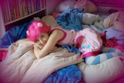 Size: 1600x1067 | Tagged: safe, artist:kapteeni-teepannu, artist:sewingintherain, pinkie pie, human, g4, bed, clothes, cosplay, irl, irl human, looking at you, photo, socks, solo, striped socks