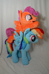 Size: 464x700 | Tagged: safe, artist:makeshiftwings30, rainbow dash, scootaloo, pegasus, pony, g4, blank flank, cute, cutealoo, female, filly, foal, irl, mare, open mouth, open smile, photo, plushie, rainbow dash plushie, scootaloo plushie, scootaloo riding rainbow dash, scootalove, smiling, spread wings, wings