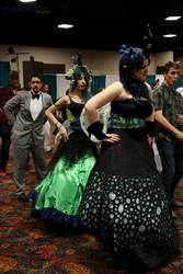 Size: 1366x2048 | Tagged: safe, artist:ashleymkalfascosplayer, artist:kyuu-vixen-cosplay, queen chrysalis, human, g4, 2014, animeland wasabi, animeland wasabi - candy kingdom, bowtie, clothes, convention, cosplay, dancing, dress, floral head wreath, irl, irl human, photo, suit