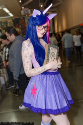 Size: 1365x2048 | Tagged: safe, artist:dtjaaaam, twilight sparkle, human, g4, 2014, book, clothes, convention, cosplay, glasses, irl, irl human, photo, skirt, tattoo, wizard world, wizard world chicago, wizard world sacremento