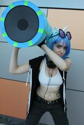 Size: 640x960 | Tagged: safe, artist:lollymimi, dj pon-3, vinyl scratch, human, g4, anime revolution, bass cannon, belly button, belly piercing, bellyring, cannon, cleavage, clothes, convention, cosplay, female, irl, irl human, midriff, photo, piercing, solo, sports bra, weapon