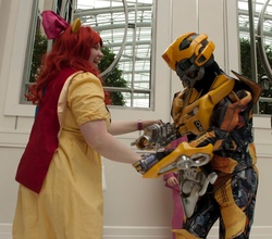 Size: 800x705 | Tagged: safe, apple bloom, human, g4, bumblebee (transformers), cosplay, dancing, irl, irl human, katsucon, photo, transformers