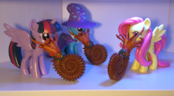 Size: 1500x833 | Tagged: safe, fluttershy, trixie, twilight sparkle, alicorn, ammonite, pony, g4, female, funko, helix fossil, mare, tentacles, toy, twilight sparkle (alicorn), wtf