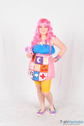 Size: 1275x1920 | Tagged: safe, artist:toshiyamioka, pinkie pie, human, fanfic:cupcakes, g4, 2013, apron, clothes, con-nichiwa, convention, cosplay, cutie mark dress, dress, irl, irl human, photo, solo, toy