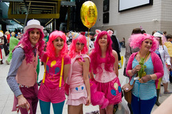 Size: 2688x1787 | Tagged: safe, artist:gavinclinton, pinkie pie, human, g4, 2013, balloon, bubble berry, clothes, convention, corset, cosplay, hat, irl, irl human, london mcm expo, multeity, party hat, party horn, photo, rule 63, suspenders, too much pink energy is dangerous, vest